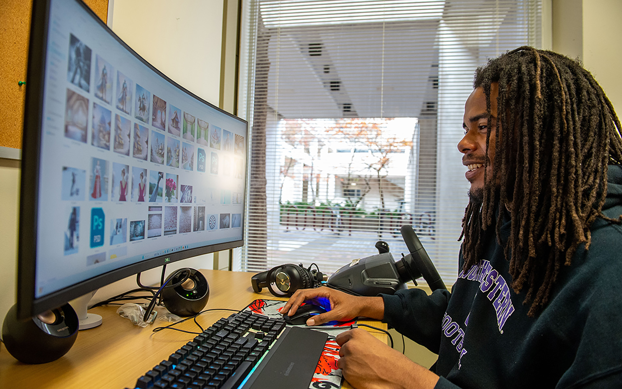 SIU Media Arts student works on a computer in the Center for Virtual Expression lab